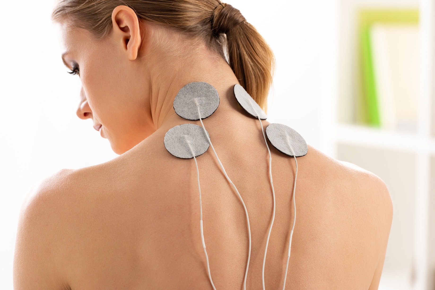 back view of beautiful woman with electrodes 