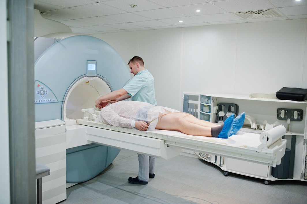 medical technician preparing patient for mri scan 2026