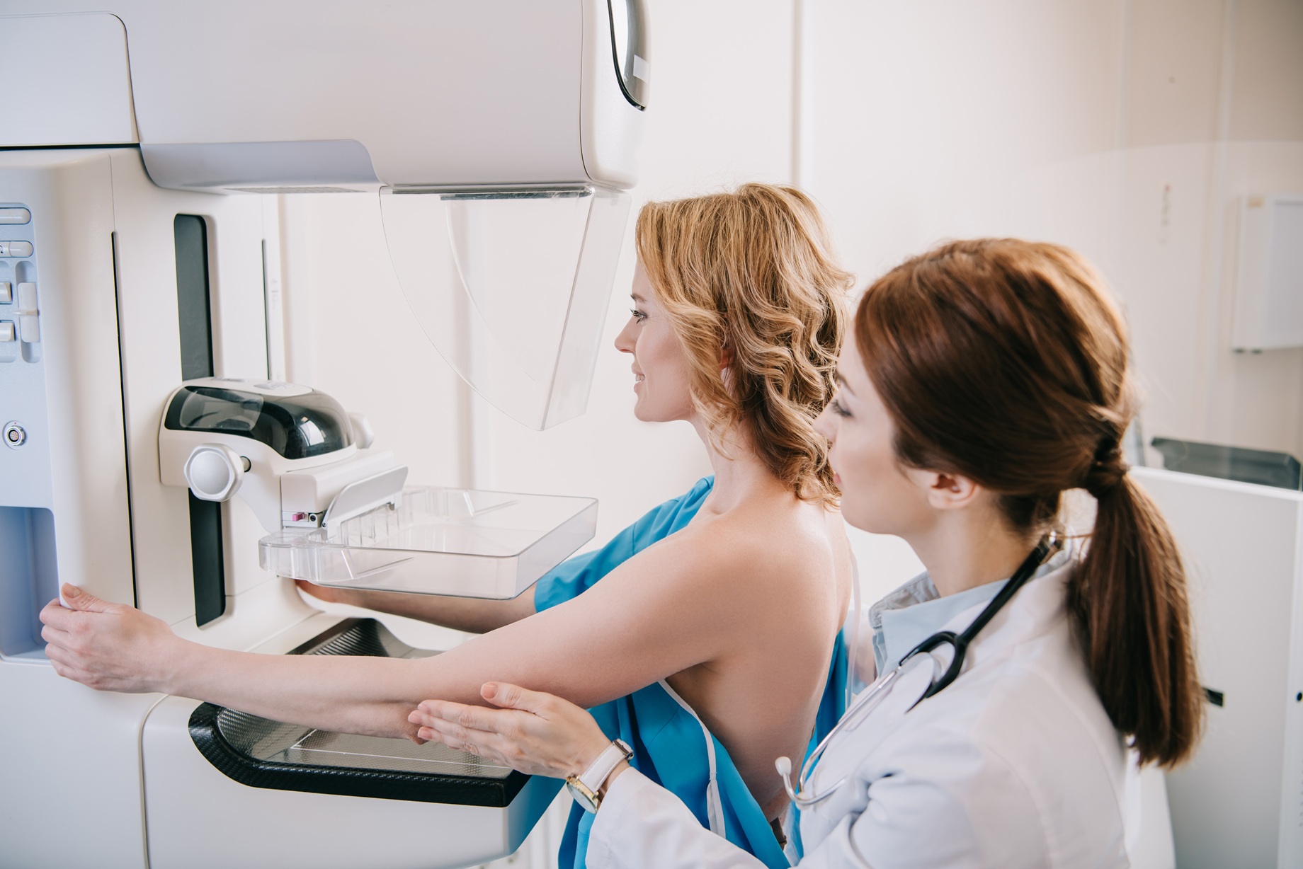 woman getting mammogram exam in a medical office 2026