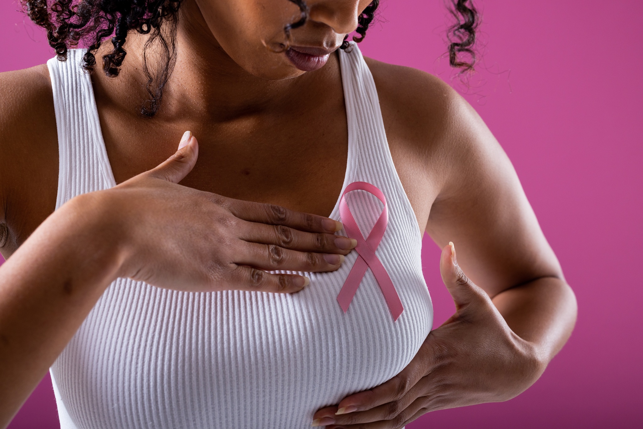 woman supporting breast cancer awareness with pink 2026