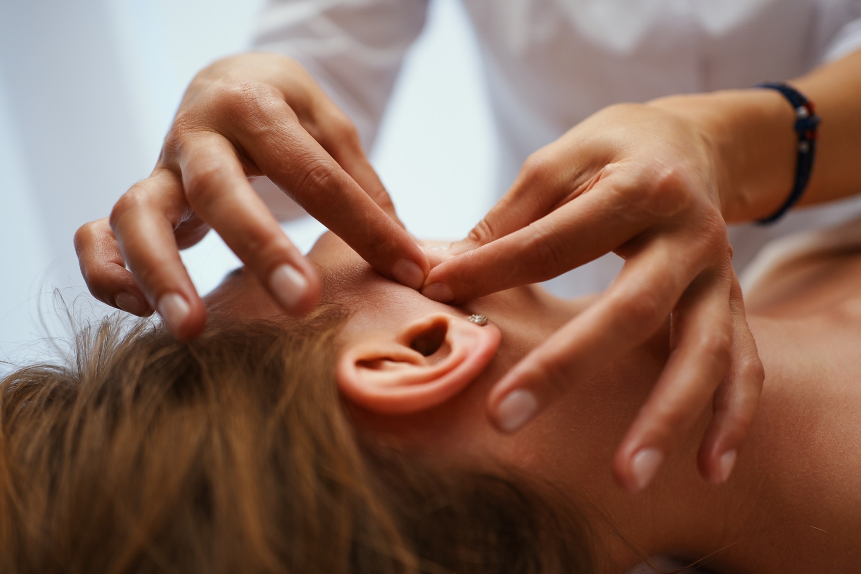 face massage young pretty woman having face massa