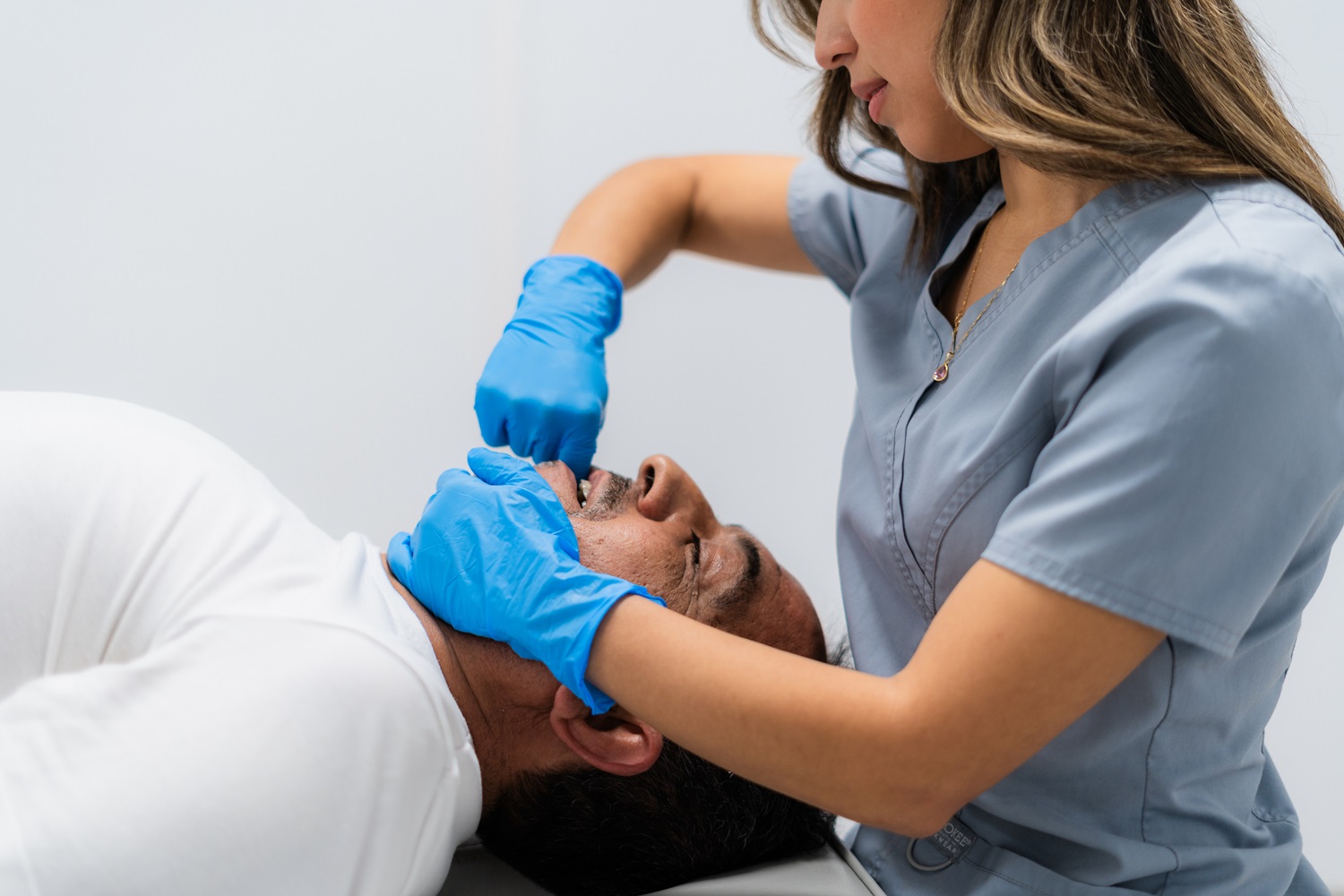 physiotherapist performing jaw physiotherapy 