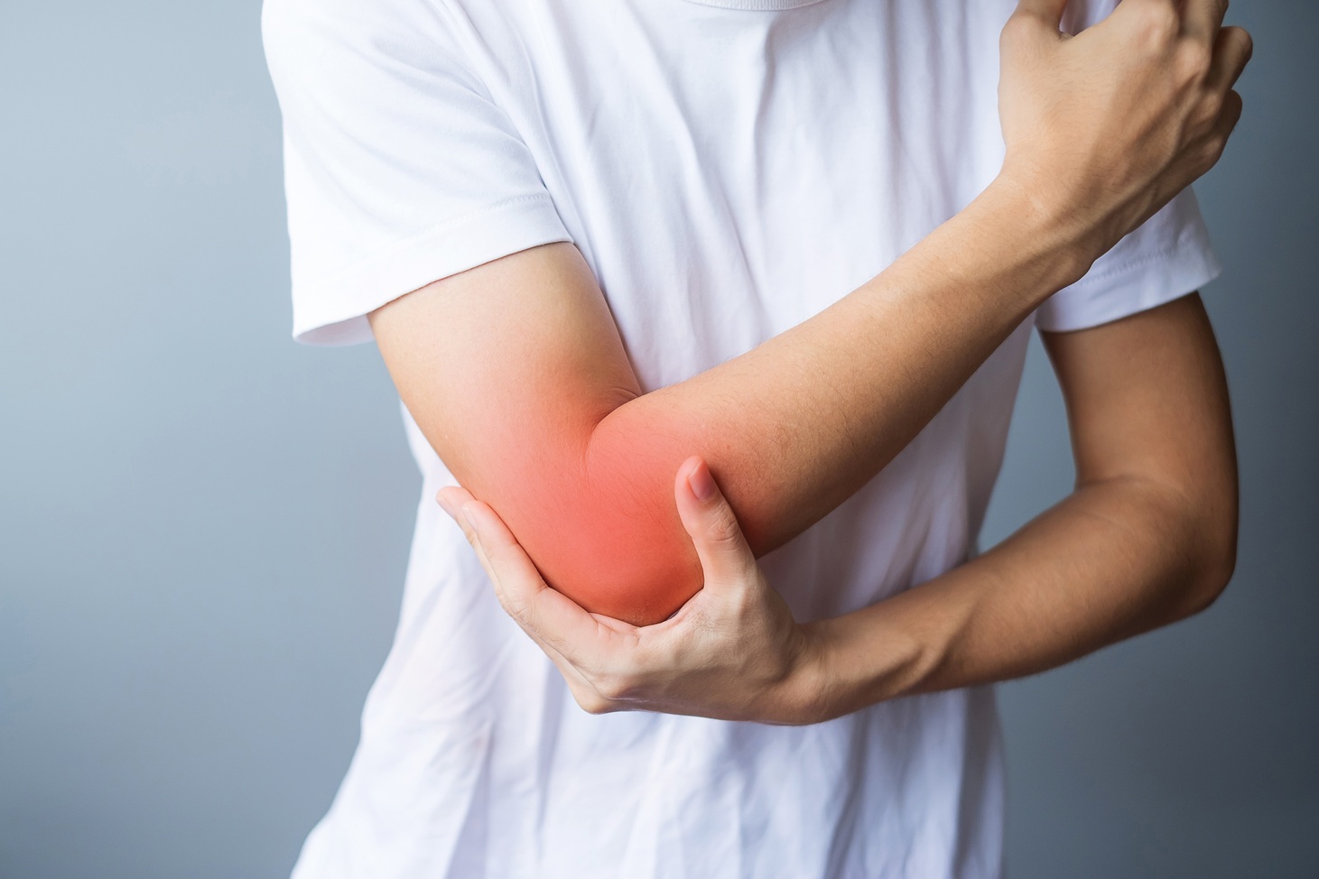 arm and elbow pain in a white shirt 2026