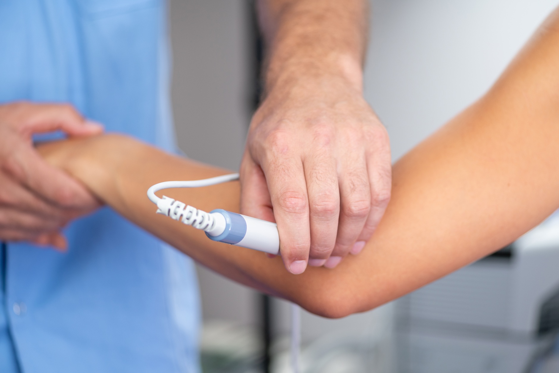 physical therapist using modern equipment for ther 2026