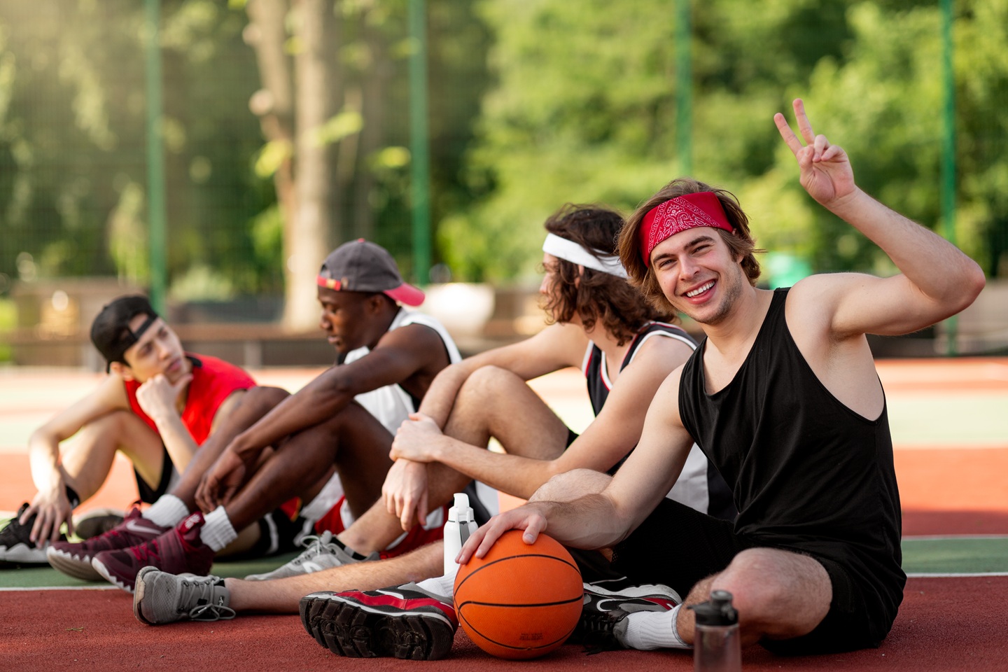 happy young basketball player and his multinationa 2026