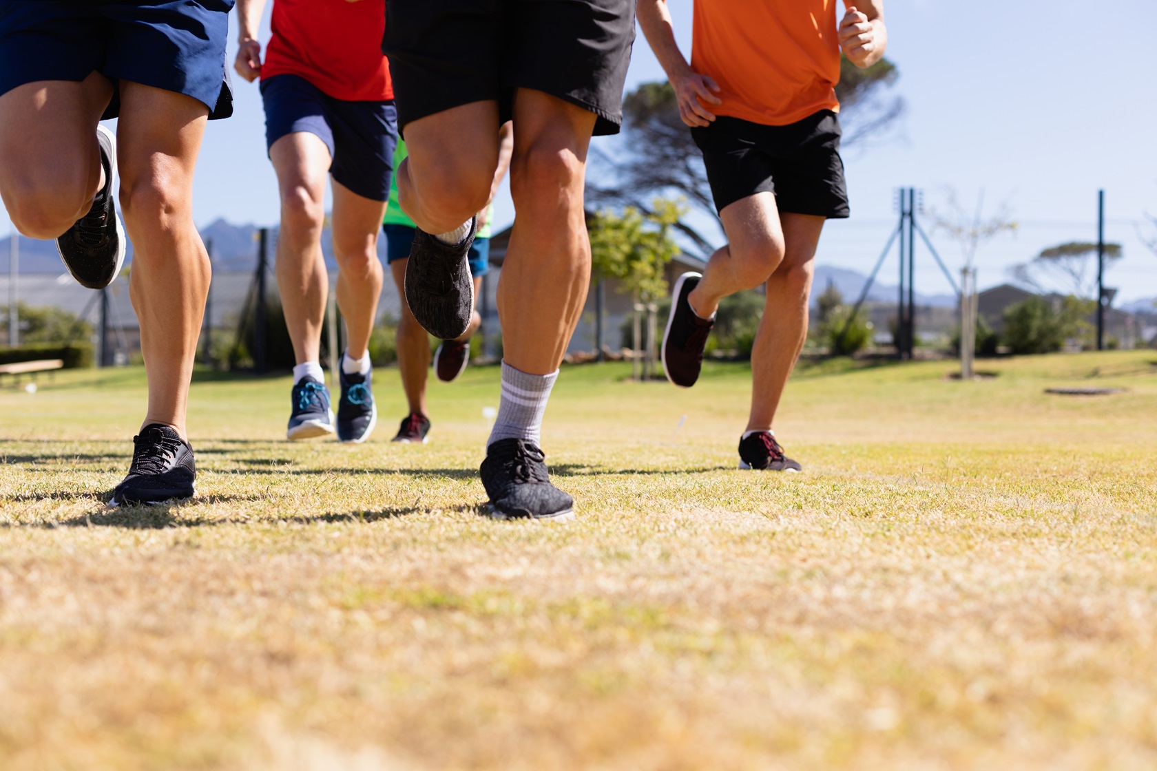 men running to train