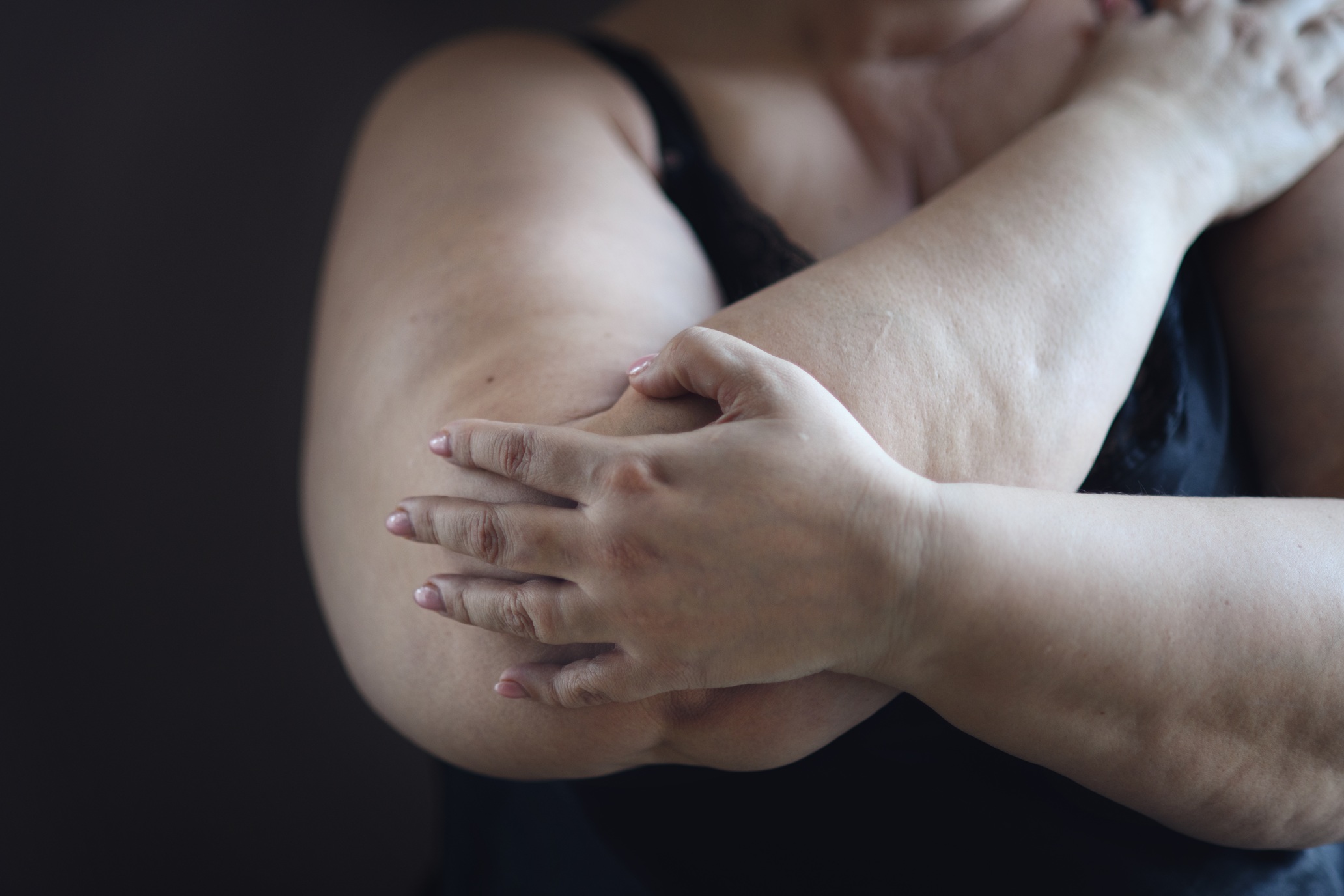 close up for obese woman body sitting and looking 2026