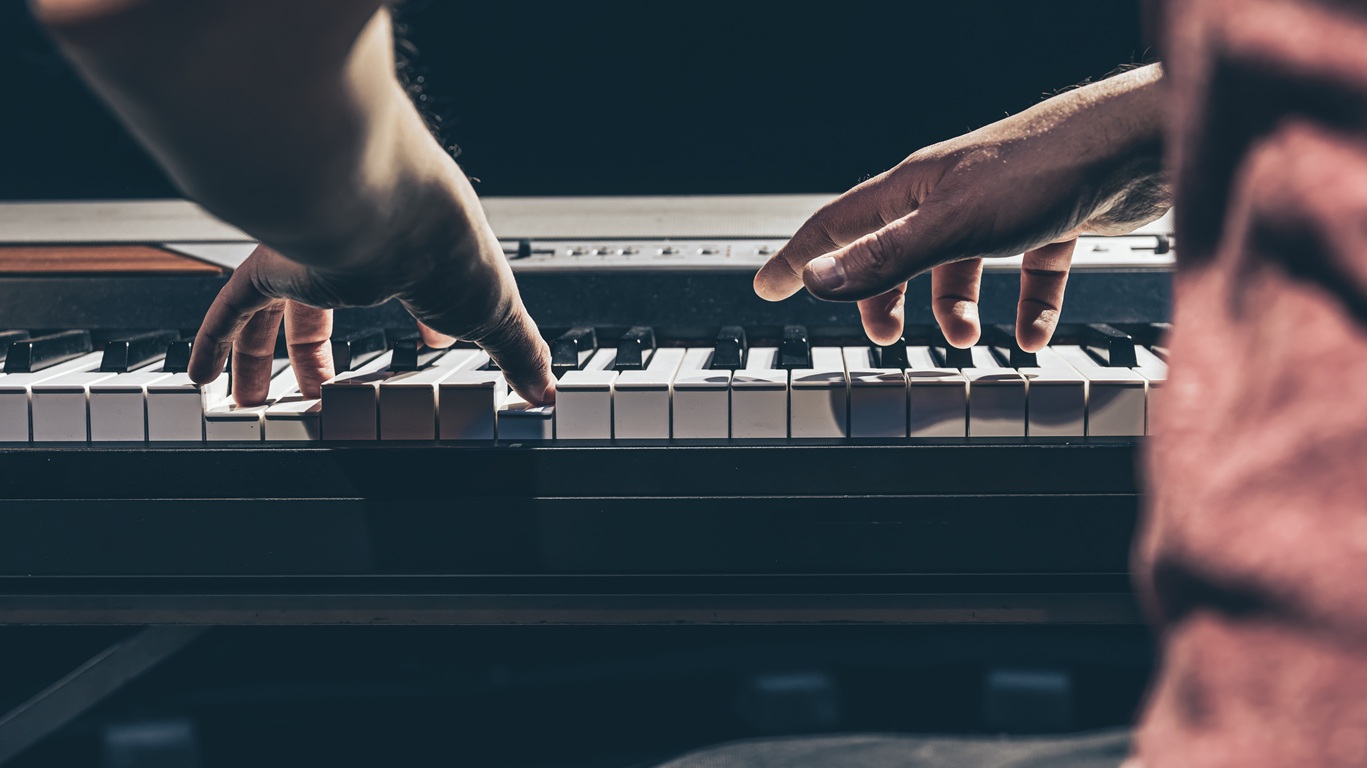hands playing music on piano keyboard instrument 2026
