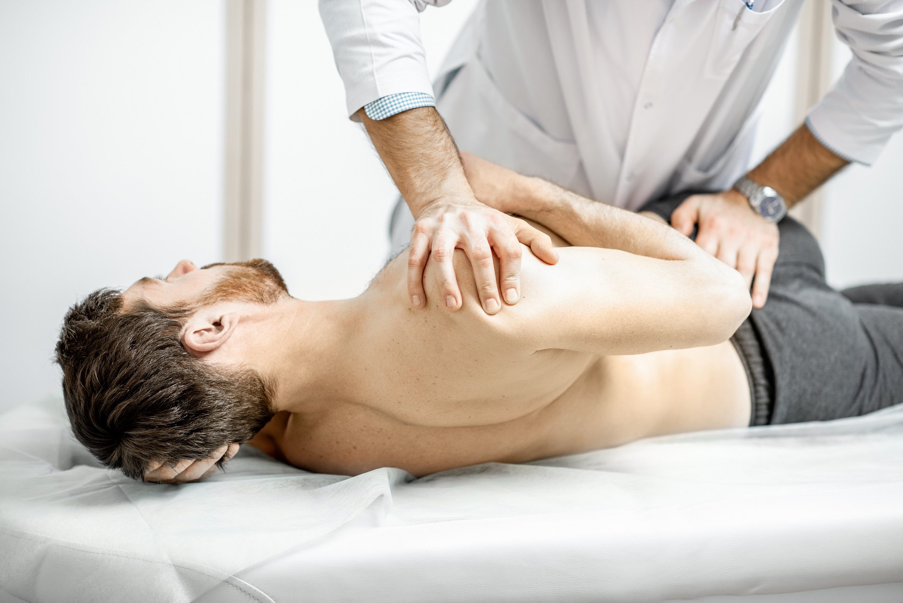 physiotherapist doing manual treatment