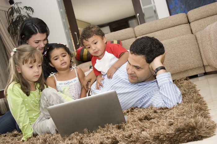 portrait of family mom and dad playing with their 2026