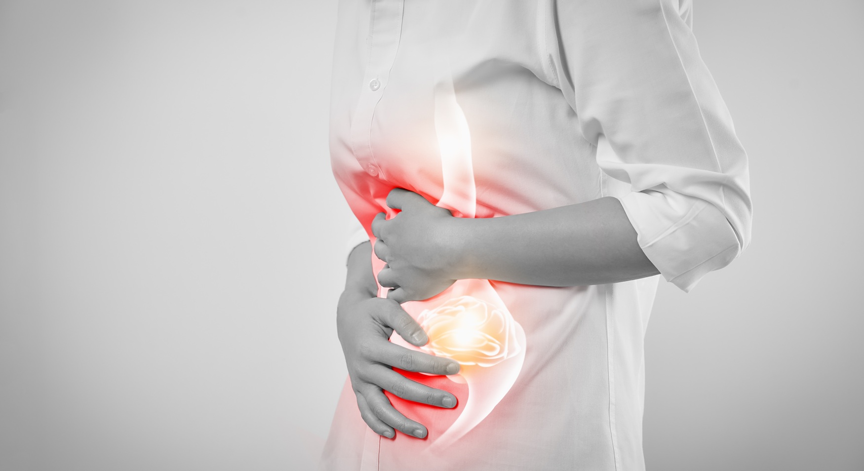 adult with stomach pain hands on abdomen 2026