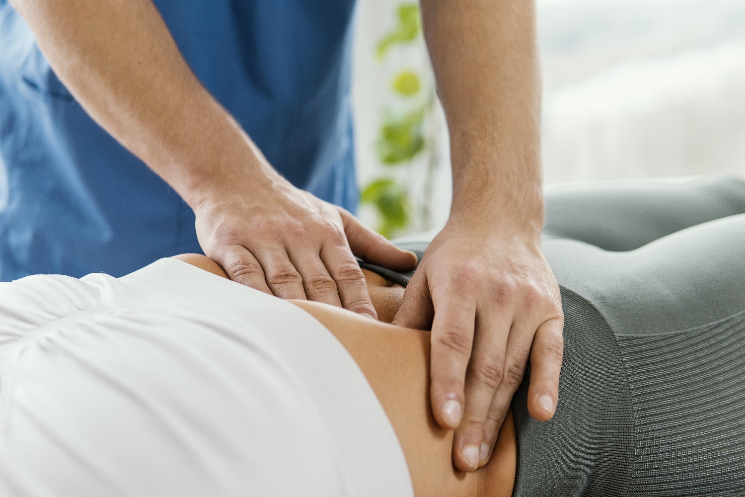 male osteopathic therapist checking